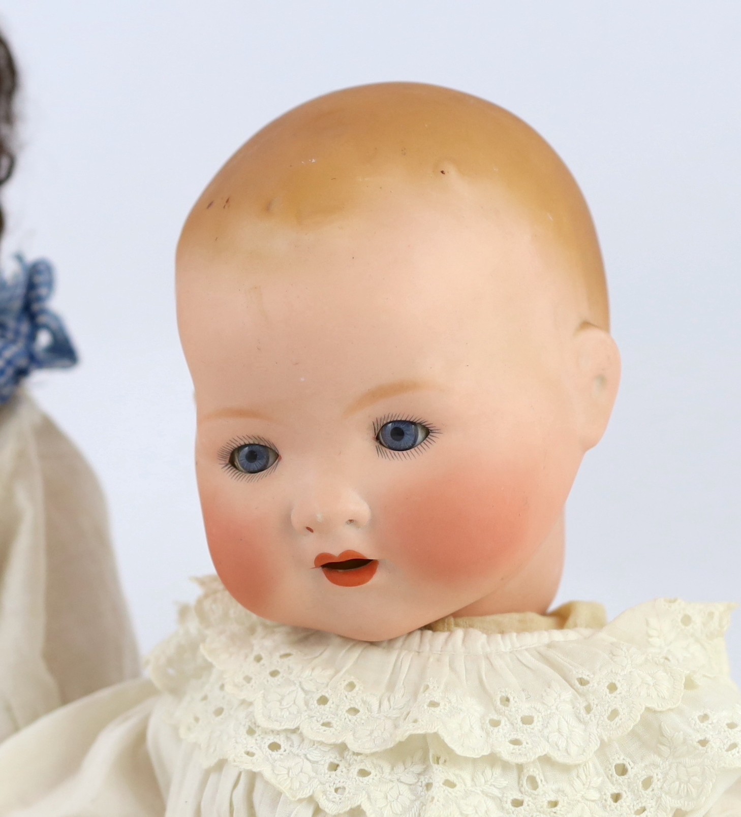 Two Armand Marseille bisque dolls, 23in. and 18in. resp.